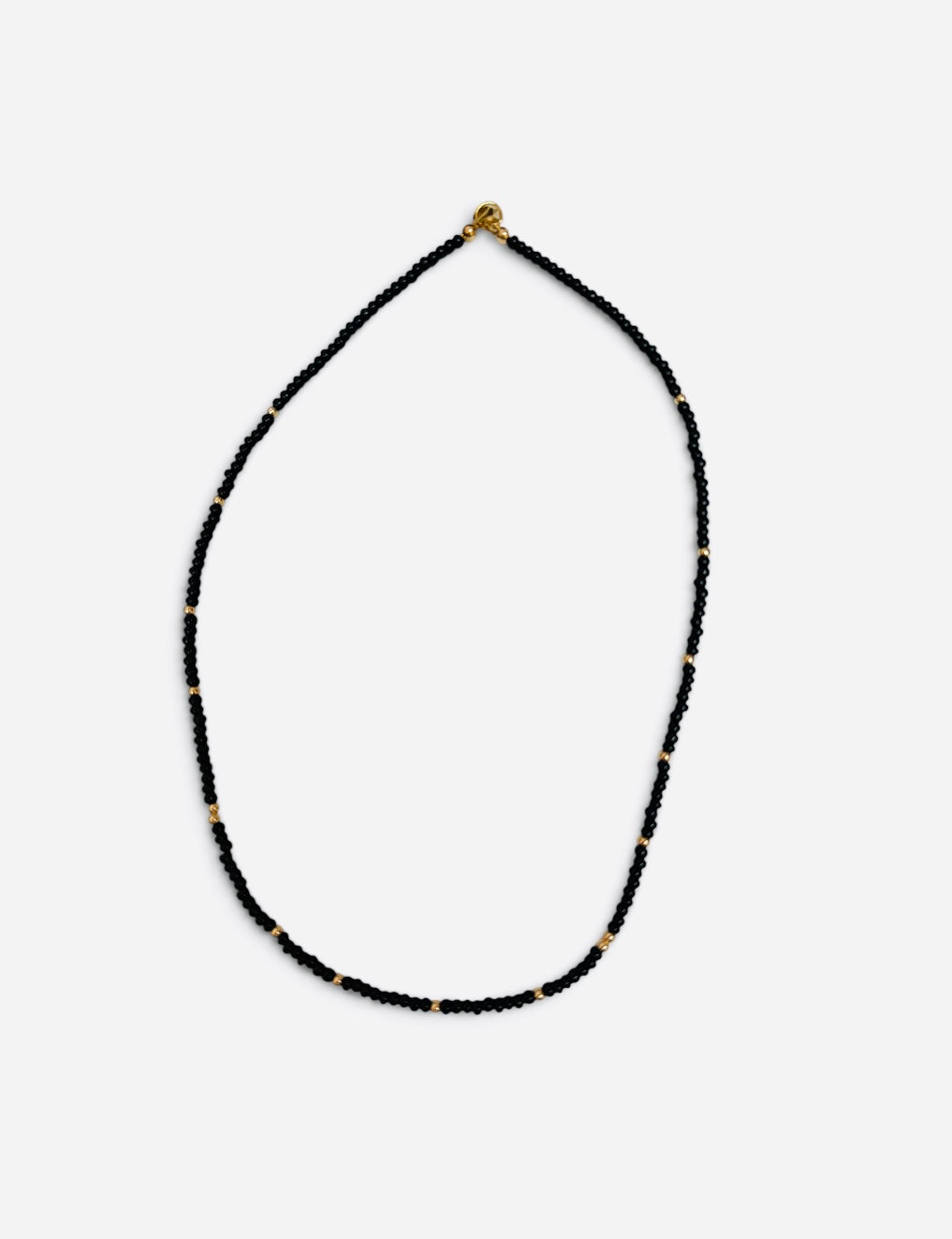 Black waterproof game day necklace with Czech glass beads and polished gold-filled accents.