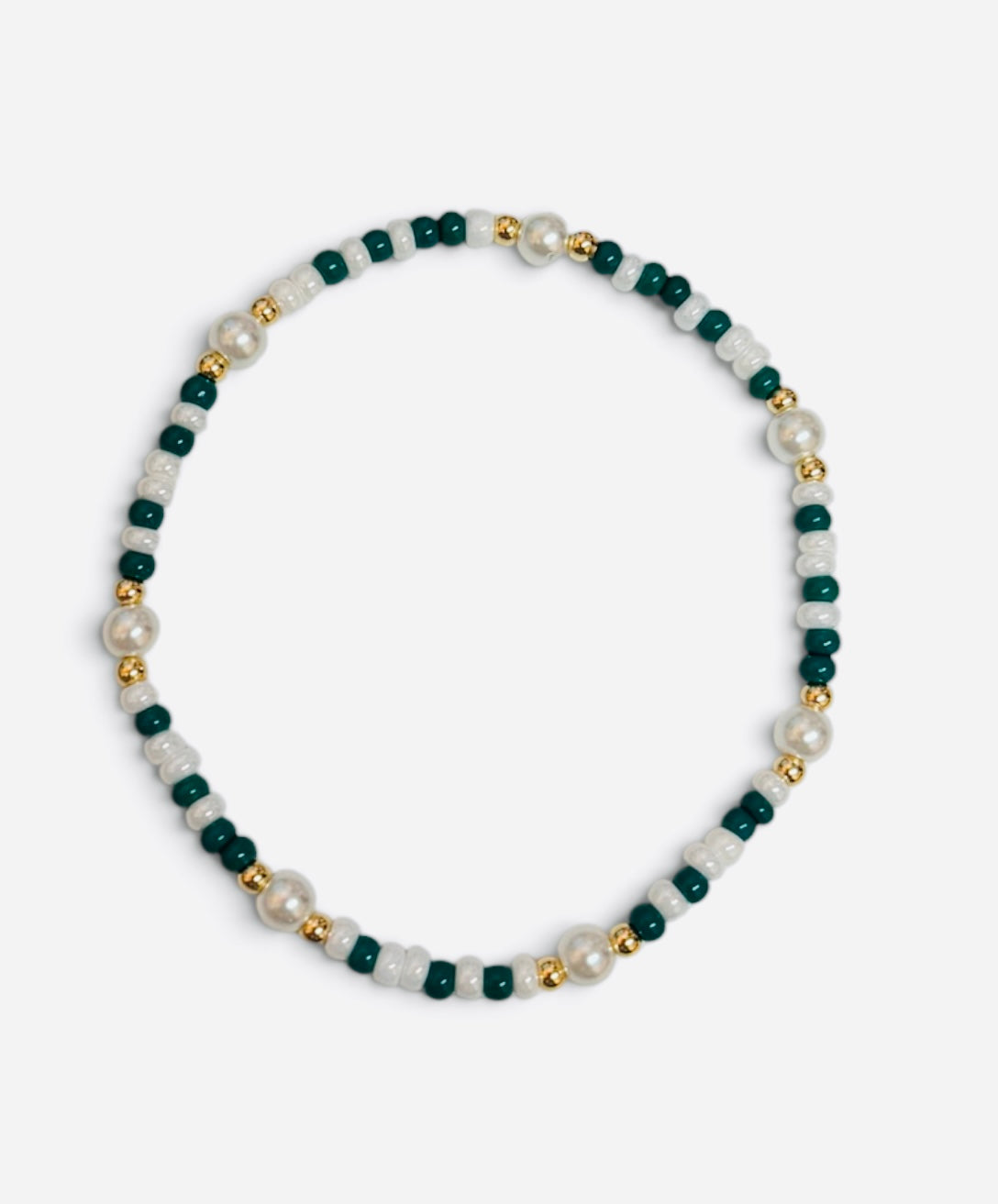 Green and white waterproof game day bracelet with gold-filled beads and glass pearl accents.