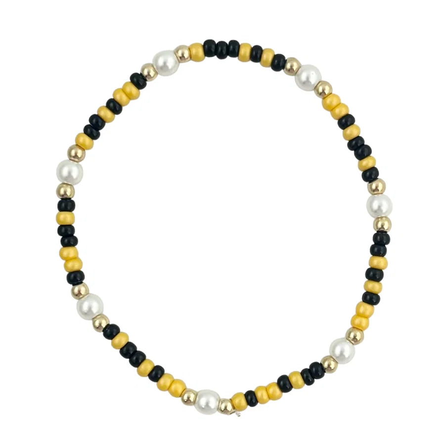 Golden yellow and black waterproof beaded game day bracelet.