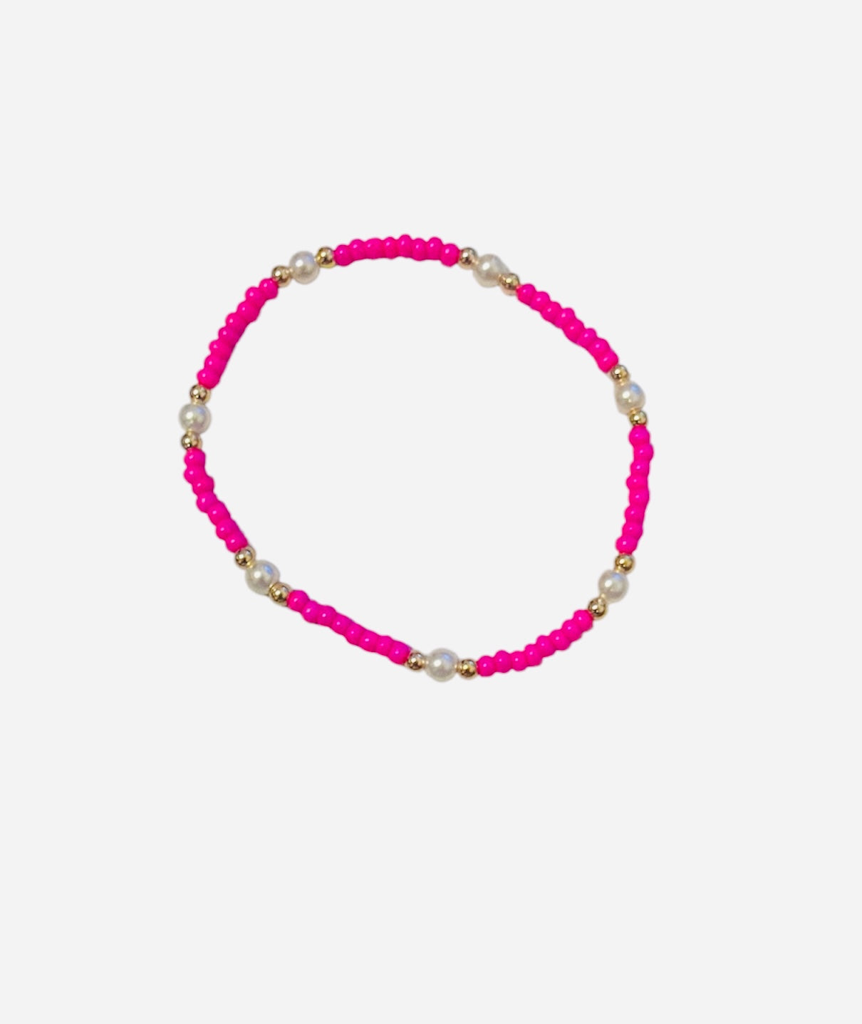Gold filled bracelet with pink beads, pearl accents, and stretch fit.