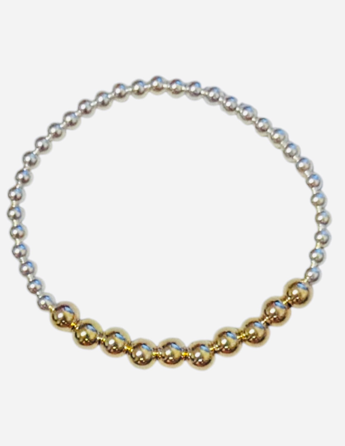 Mixed metal bracelet with sterling silver and gold-filled waterproof beads.
