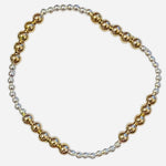 Mixed metal gold and silver beaded waterproof stretch bracelet.