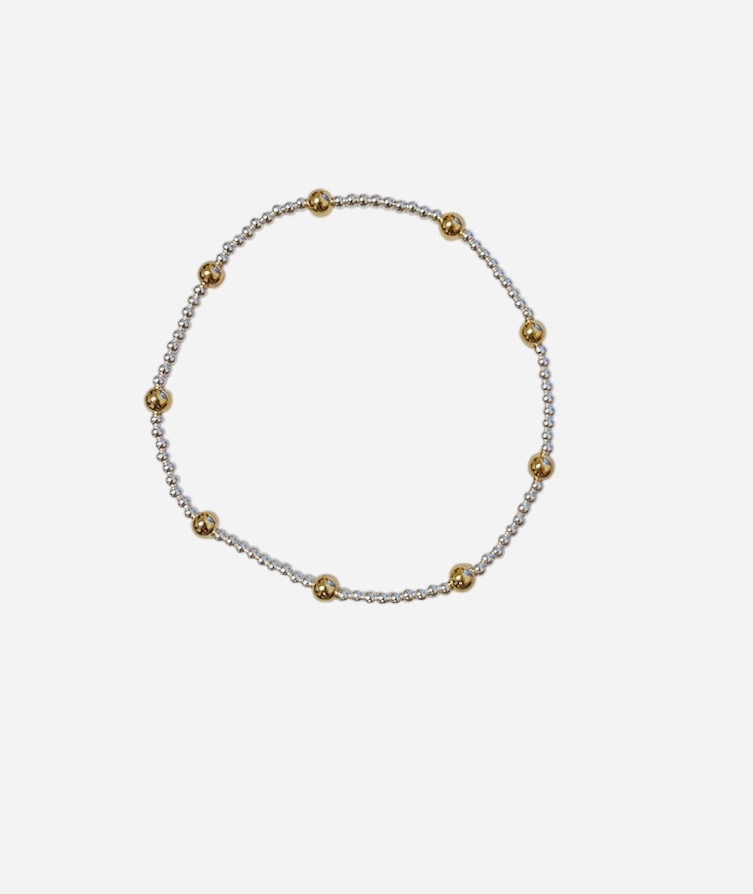 Mixed metal bracelet with sterling silver and gold filled beaded pattern.