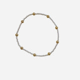Mixed metal bracelet with sterling silver and gold filled beaded pattern.