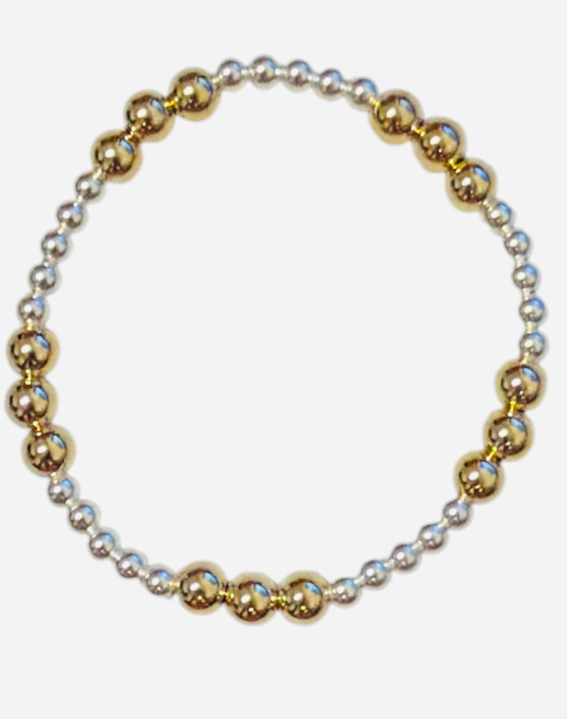 Mixed metal bracelet with gold and silver beaded waterproof design.
