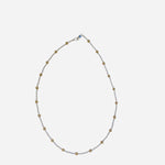 Mixed metal gold and silver beaded necklace with classic patterned design.