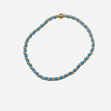 Gold filled bracelet with turquoise beads, pearl accents, and stretch fit.
