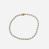 Gold filled bracelet with white beads, pearl accents, and stretch fit.