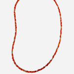 Gold filled necklace with orange beads and silver accent details.
