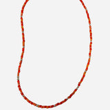 Gold filled necklace with orange beads and silver accent details.