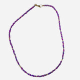 Gold filled necklace with purple beads and gold accent details.