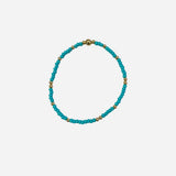 Gold filled bracelet with sea green Czech glass beads and stretch fit design.