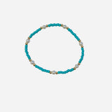 Gold filled bracelet with teal beads and pearls in stretch design.