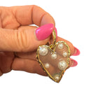 Gold scarf charm with lucite heart, pearl heart, and easy clip-on attachment.
