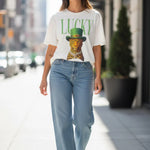 White Lucky Leopard tee with green lettering and crystal embellished hat detail.