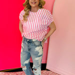 Pink striped boxy top with ruched elastic sleeves and relaxed modern fit.