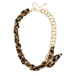 Leopard print scarf necklace with gold chain and adjustable length.