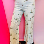 Ivory wide-leg cropped jeans with all-over mallard duck print and high-rise fit.