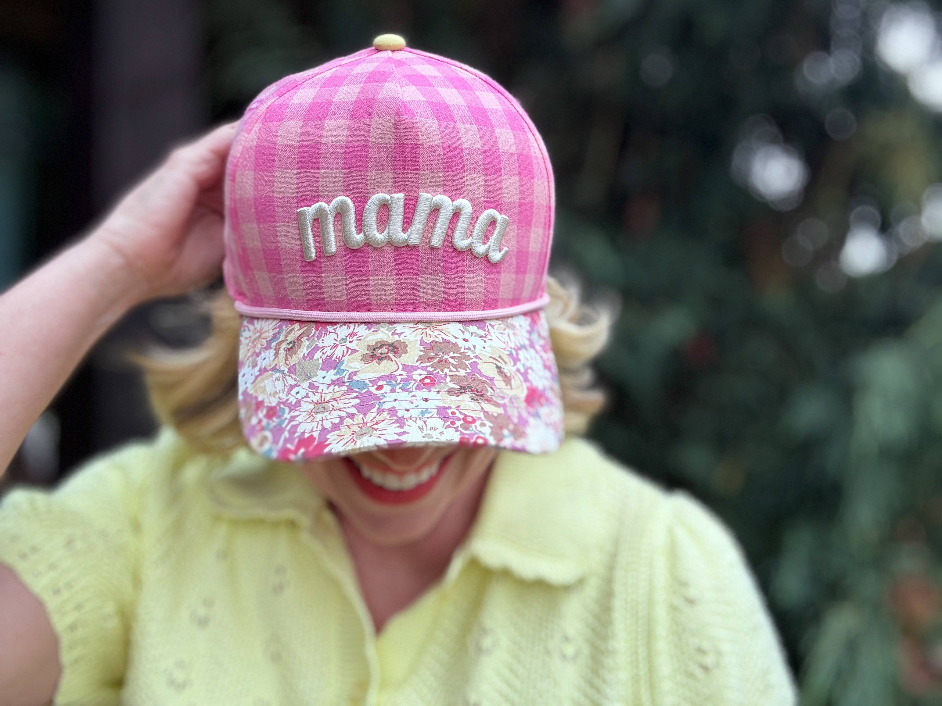 Pink gingham mama hat with floral bill and yellow snapback closure.