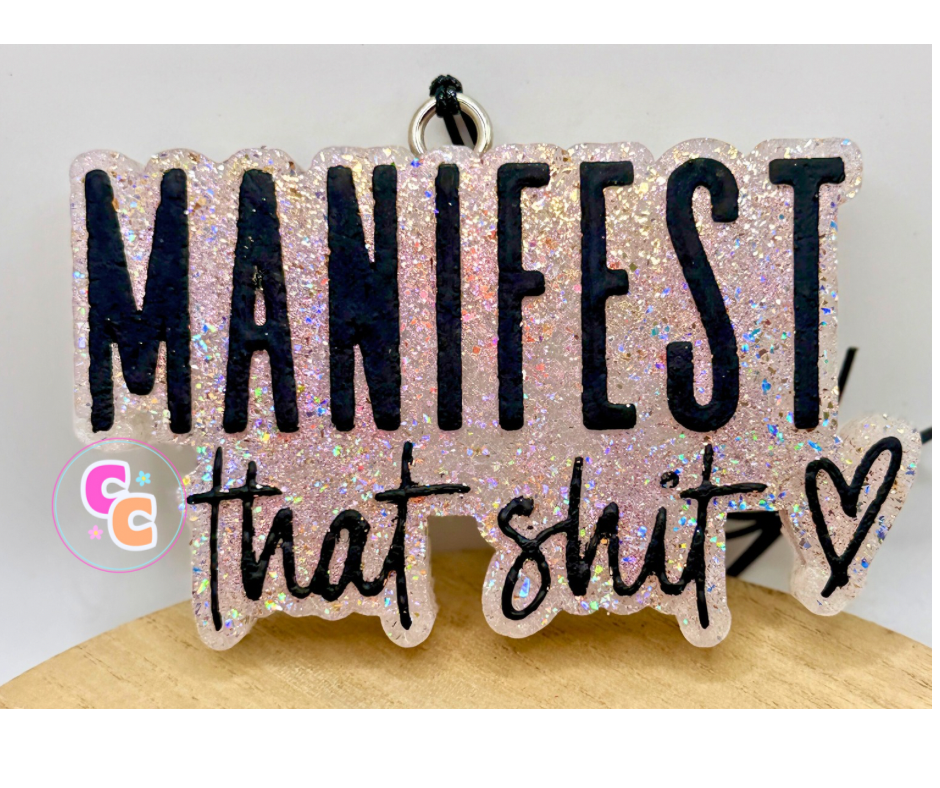 Manifest That Shit freshie featuring a heart accent and motivational quote.