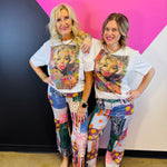 White Marilyn graphic tee with colorful graffiti artwork and rhinestone embellishments.