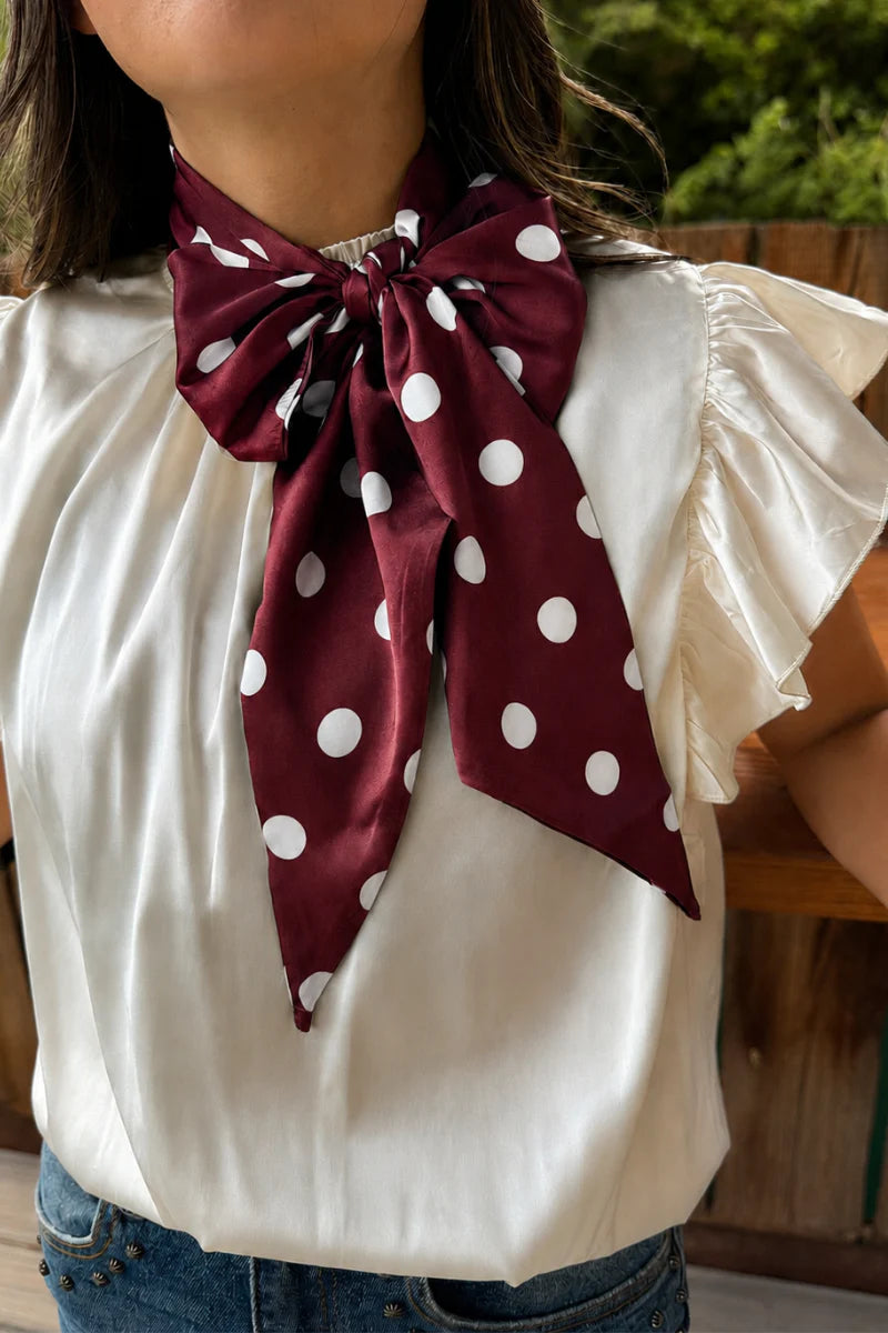 Maroon and white silky polka dot scarf with versatile styling options.