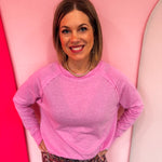 Mauve cotton raglan top with thumbhole cuffs.