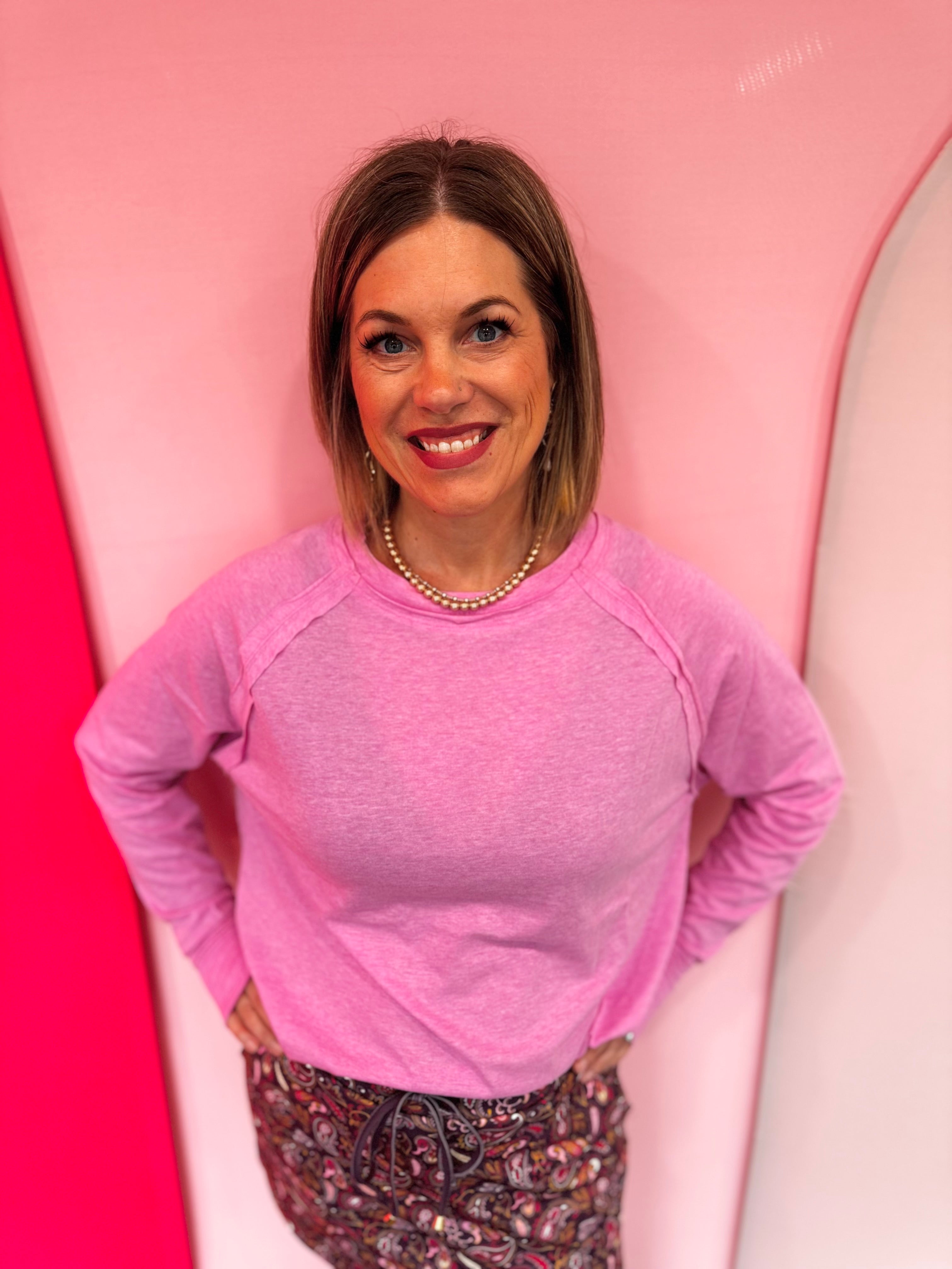 Mauve cotton raglan top with thumbhole cuffs.