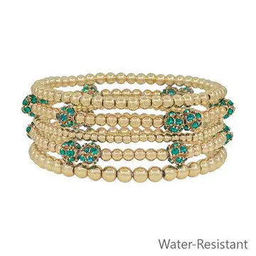 Five-piece gold and emerald pave ball stretch bracelet set with CCB beads.