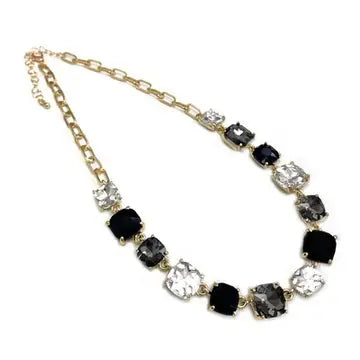 Aster Black Multi Crystal Necklace, 16–18 in gold chain with alternating black and clear faceted stones.