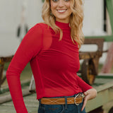 Solid red long-sleeve mesh top with stretchy fit, perfect for bold layering or standout styling.
