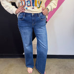 Denim wide-leg jeans with high-rise waist and statement stud detailing along the sides.