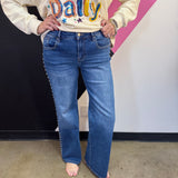 Denim wide-leg jeans with high-rise waist and statement stud detailing along the sides.