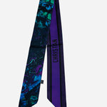 Colorful twilly scarf with floral and butterfly inspired artwork.