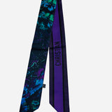 Colorful twilly scarf with floral and butterfly inspired artwork.