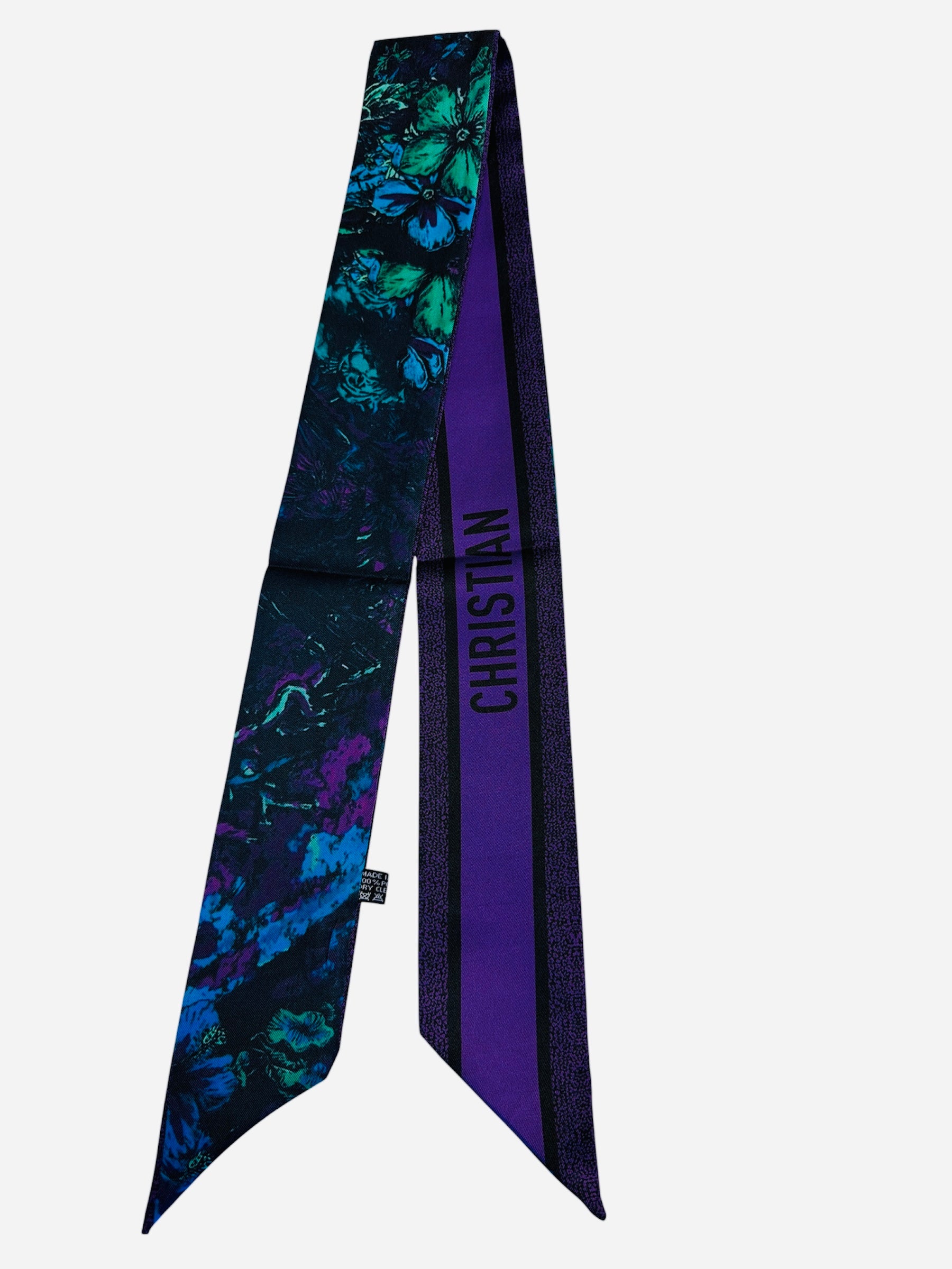 Colorful twilly scarf with floral and butterfly inspired artwork.