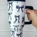 Black bow print tumbler with handle and reusable straw