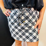 Black and white plaid skort with built-in shorts, drawstring waist, and pockets.