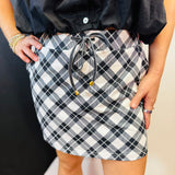 Black and white plaid skort with built-in shorts, drawstring waist, and pockets.