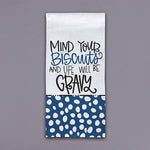Tea towel with hand-lettered phrase mind your biscuits and blue polka dot bottom panel