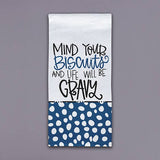 Tea towel with hand-lettered phrase mind your biscuits and blue polka dot bottom panel