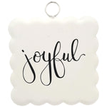 Metal wall sign with scalloped edge and joyful handwritten script
