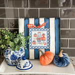 Blue pumpkin topiary with chinoiserie pots, bows, and lattice border on 12x12 fall metal board