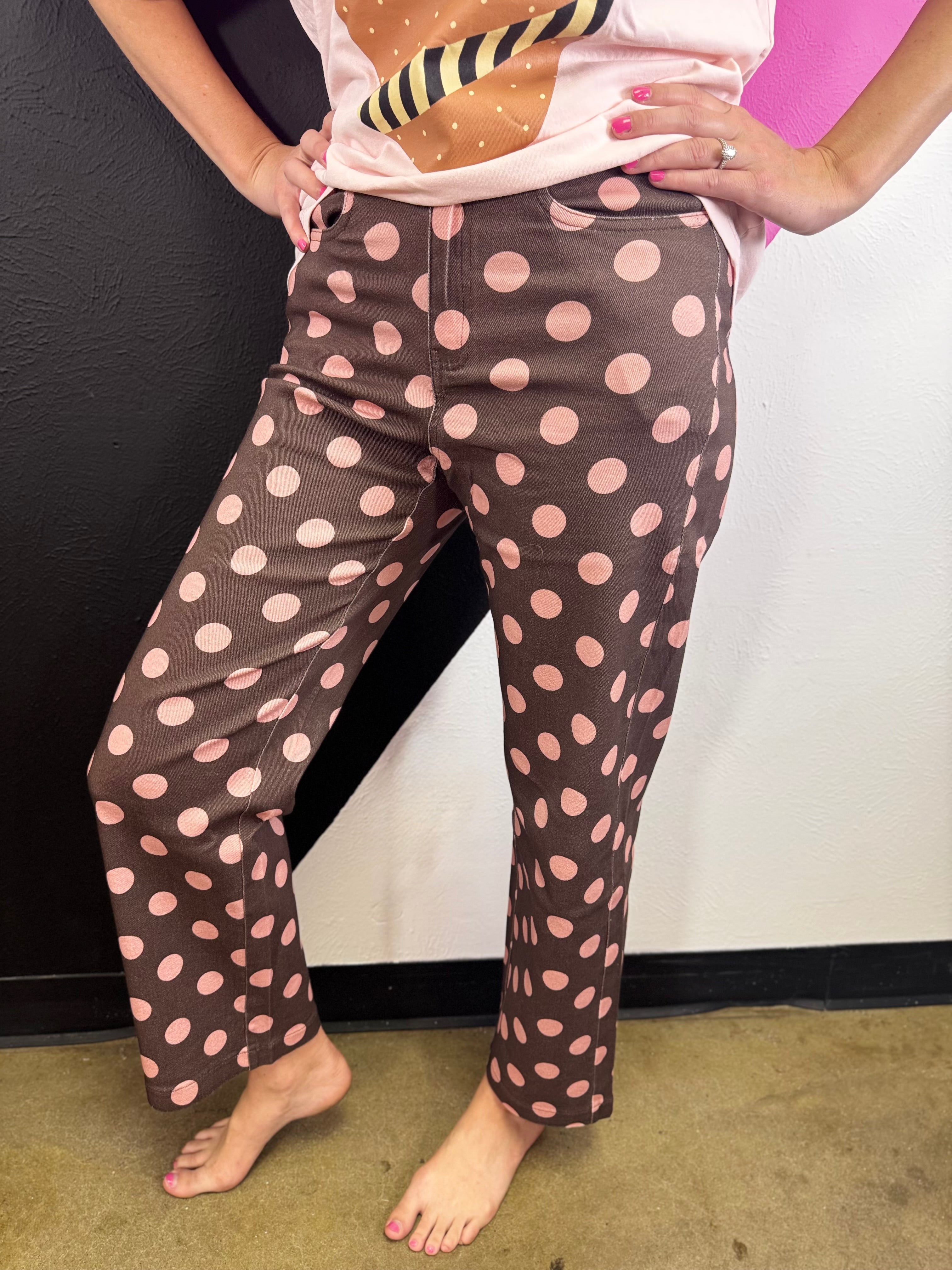 Mocha cotton twill pants with oversized pink polka dots and wide straight legs.