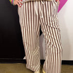 Mocha and white vertical striped wide leg pants with drawstring waist and pockets.