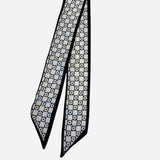 Black and ivory twilly scarf with checkerboard and daisy print.