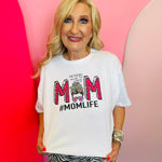 White mom graphic tee with leopard MOM lettering and doodle accents.