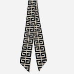 Black and ivory twilly scarf with bold geometric maze print.