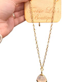 Gold chain necklace with mother of pearl pendant and elongated oval links. Water-proof design.