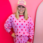 Tan hat with pink “Motherhood” embroidery, pink plaid brim, and rope detail snapback